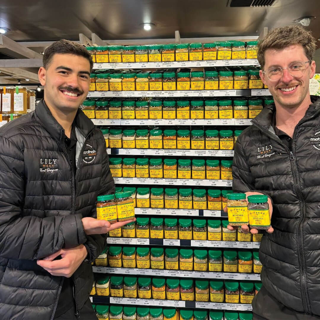 Metro Fresh Findon staff holding spices in seasoning range isle